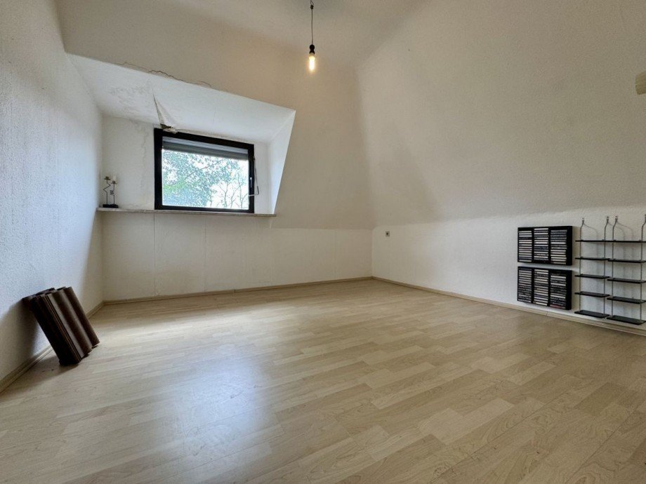 Wohnen DG Mehrfamilienhaus Langen